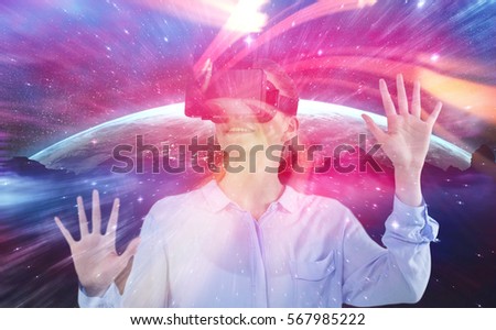 Businesswoman experiencing virtual reality against red vortex with orange light