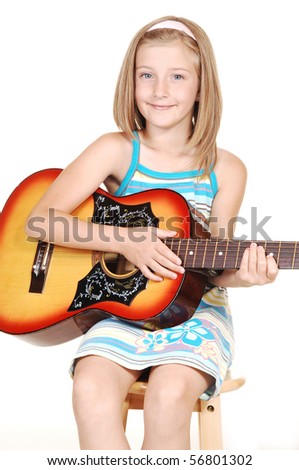 A pretty young blond girl, sitting on a chair with her guitar in her hands to praxis her talent, for white background.