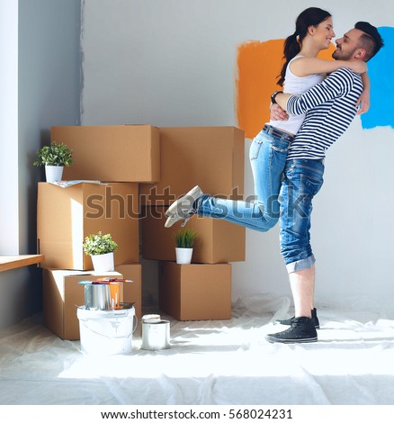 Happy young couple moving in new house