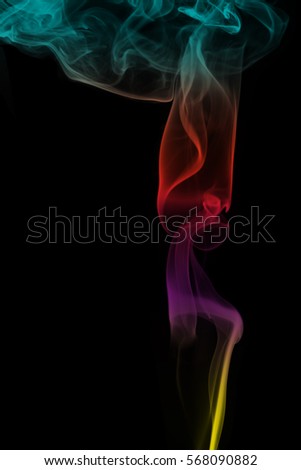 Abstract colorful smoke pattern over the black background