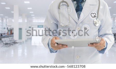 Doctor or medical students using digital tablet with medical icon at hospital. Medical network concept.