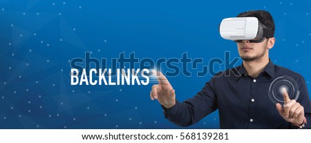 Future Technology and Business Concept: The Man with Glasses of Virtual Reality and touching BACKLINKS button