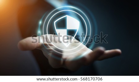 Businessman on blurred background using shield safe protection to protect his datas 3D rendering