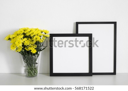 mock up  frame photo  and yellow flowers. 
