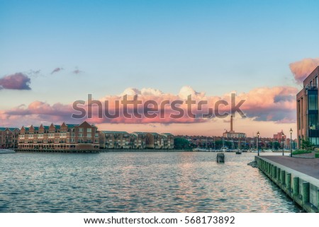 Baltimore, USA. Harbor view at sunset and deep colored sky. Splittoned, vivid image 