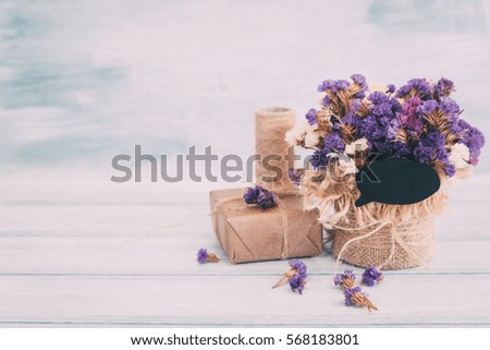 Bouquet of dried flowers on the wooden background 