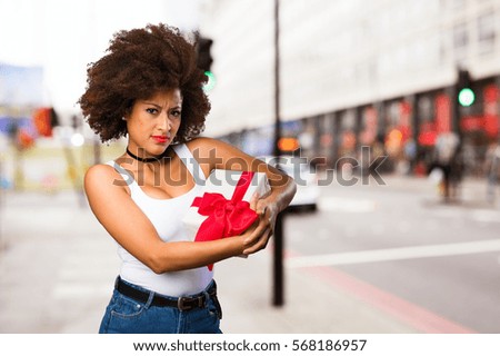 young black woman holding a gift