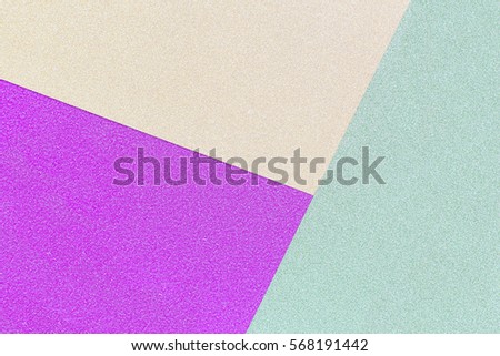 background of the three colors green, purple and yellow shiny paper. Texture of fashion, minimal concept, Flat lay, Top view.