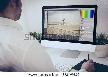 freelance photographer working with  computer and graphic pen