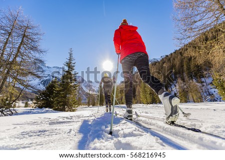 A family group of cross country skiers on a sunny winter morning in Italy Alps, South Tirol, Solda. Royalty-Free Stock Photo #568216945