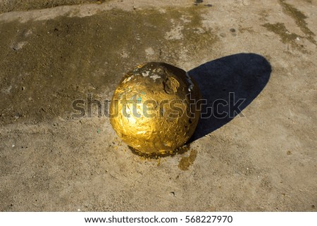 Golden ball on the floor