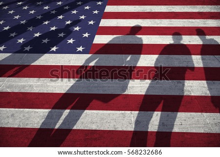 Shadows of group of people walking through the city streets with painted Usa flag on the floor. Concept political relations with neighbors.