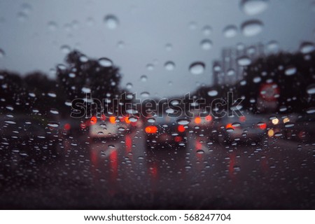 Blurry image of traffic jam during rainy day        