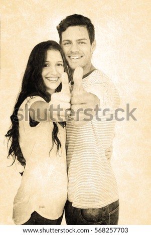 Grey background against couple with thumbs up