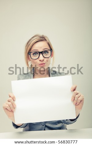 young business woman holding empty white board