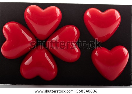 Plastic red valentine hearts isolated
