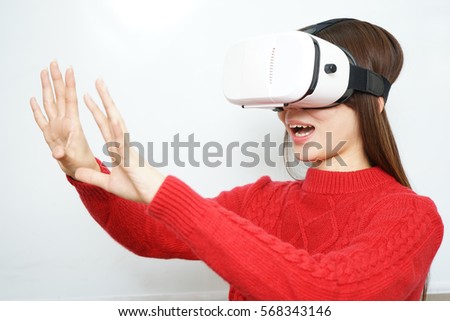 Young attractive Japanese woman using VR-headset glasses