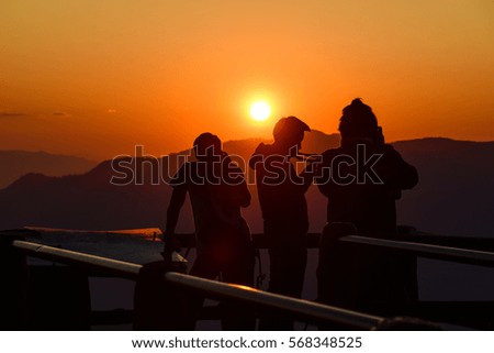 Silhouette of photographer, taking pictures of the beautiful moments during the sunset ,sunrise.