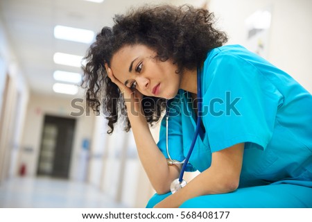 Emotional stress of young doctor Royalty-Free Stock Photo #568408177