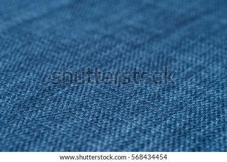 Blue fabric texture. Abstract background, empty template. Selective focus.