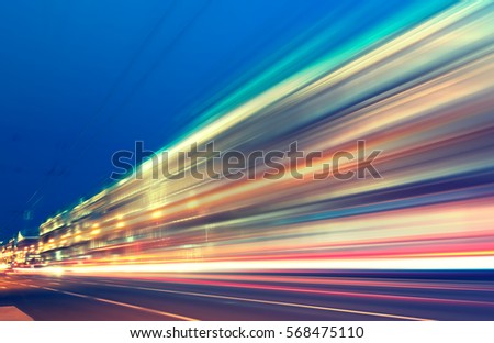 abstract image of blur motion of cars on the city road at night Royalty-Free Stock Photo #568475110