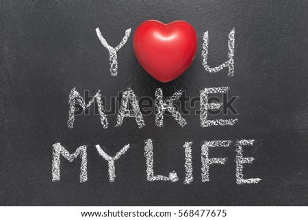 you make my life phrase handwritten on blackboard with heart symbol instead of O