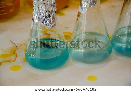 Group of laboratory flasks empty or filled