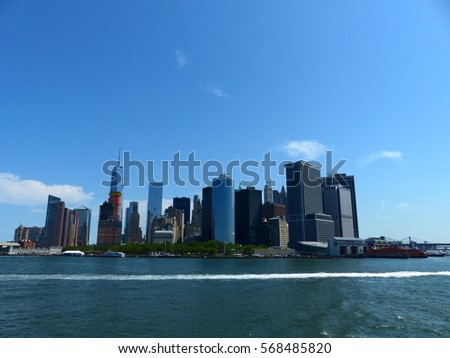 New York City, Manhattan, New York, USA, America. 15 July 2015. NYC buildings and skyscrapers from the river with nice blue colours for the sky and the downtown city 