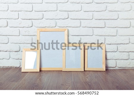 Picture frame on brick wall
