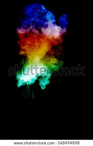 abstract multicolored powder splatted on black background,Freeze motion of color powder exploding/throwing color powder, multicolored glitter texture.