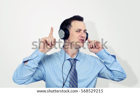 Office man listening to music on headphones