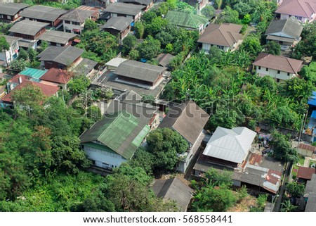 Retire in Thailand and find a cheap and tropical area to live where rents and homes are cheap to purchase.  Rural outskirts district of Bangkok. Royalty-Free Stock Photo #568558441