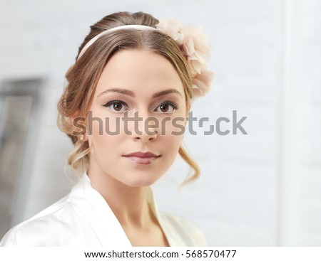 Closeup portrait of young blonde bride on wedding-day.