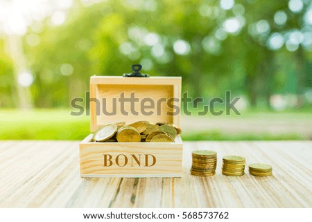 Business Concept : BOND word on box over blur and sunlight background.