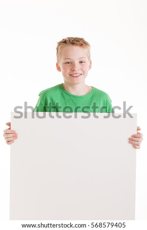 Portrait of happy boy with the empty blank sign isolated on white
