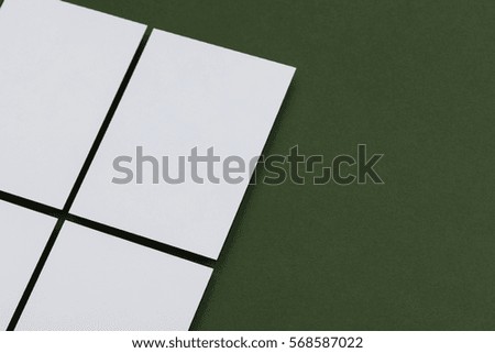Blank white postcard on a green background