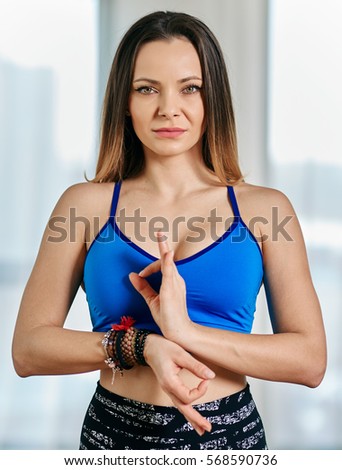 Woman yoga teacher with traditional greeting in closeup