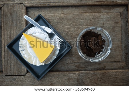 Coffee & cake on wooden table background in breakfast meal