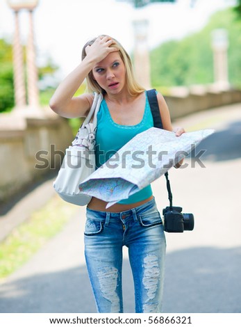 woman tourist with map and camera