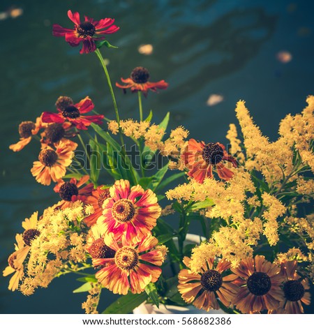 Bouquet of bright colorful summer flowers, square vintage toned photo, old instagram style filter