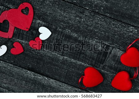 red hearts on dark wooden table. Valentines Day concept
