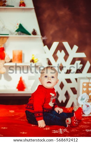 Cute little boy laughing in  New Year  studio