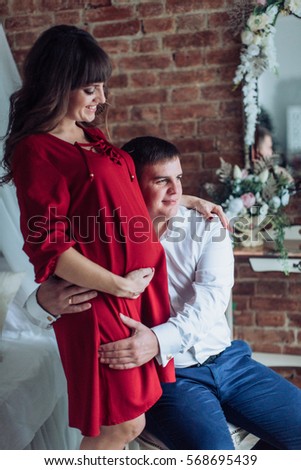 Beautiful pregnant woman with her husband