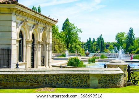 Beautiful small house in the center of the Hyde park in London with pond and fountains. Royalty-Free Stock Photo #568699516