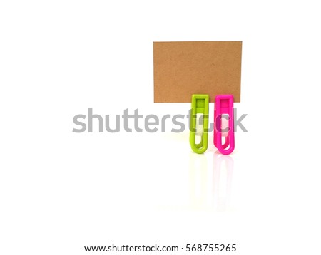 brown label and color clothspin in white background