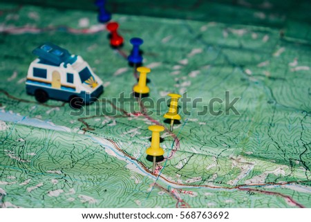 Toy Bus is on a topographic map, the route indicated by the pushpin