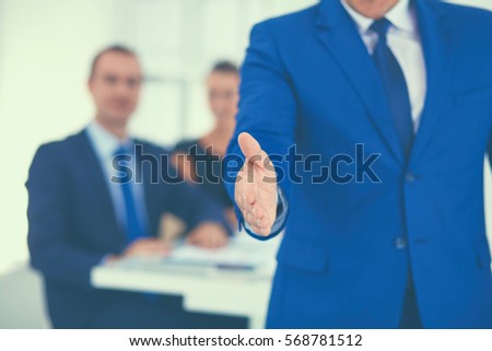 Closeup of a business handshake in office