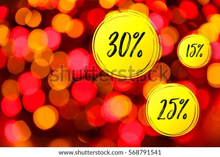 Blurred lights red background. Sale discounts circles. Glittering christmas effect. Shimmering blur spots. Festive design.