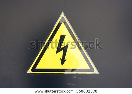 Sticker triangle high voltage sign on wall