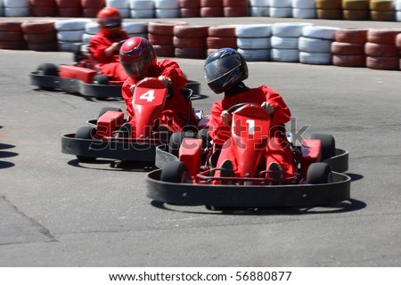 Go cart racers struggling on circuit. Royalty-Free Stock Photo #56880877